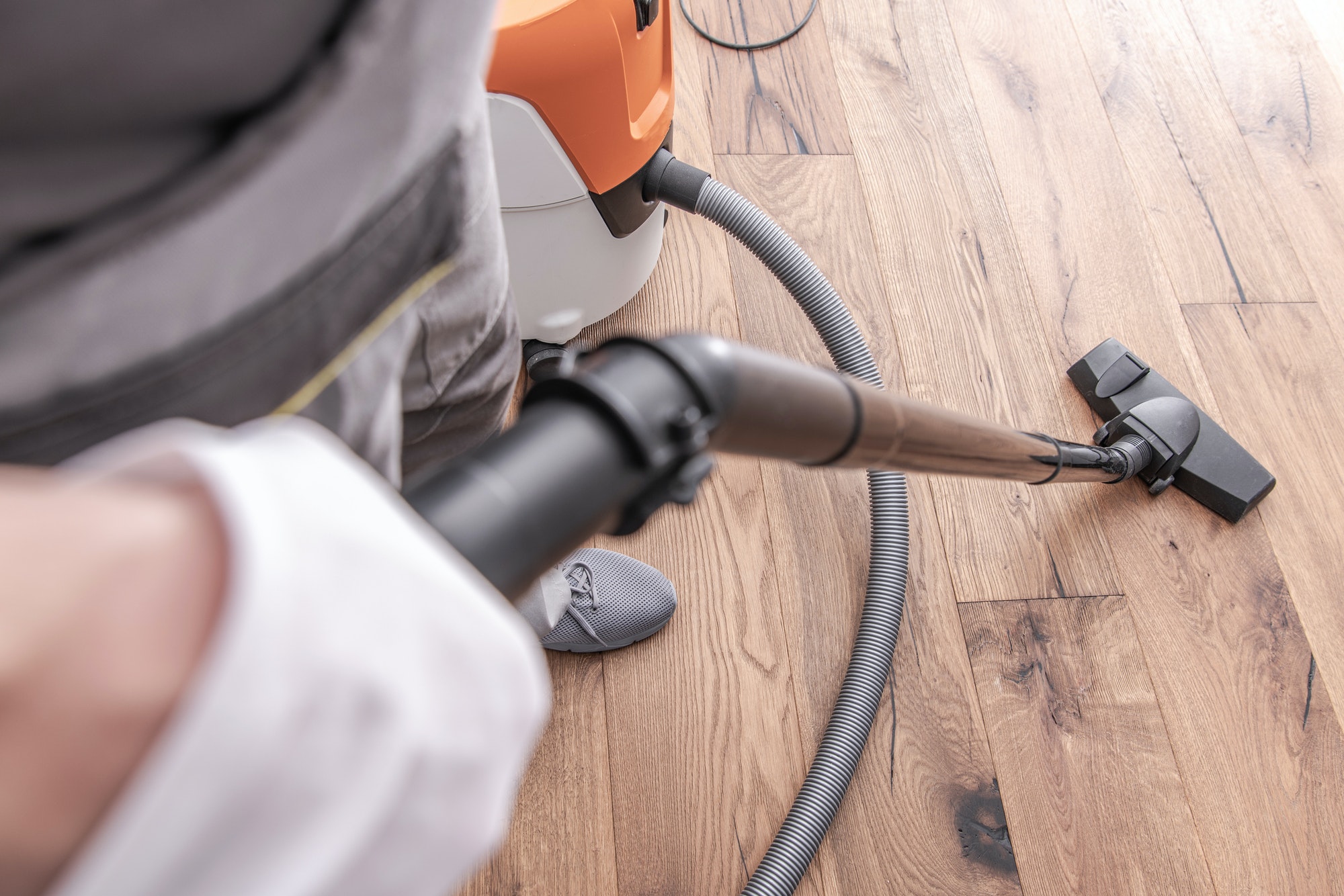 male-worker-vacuuming